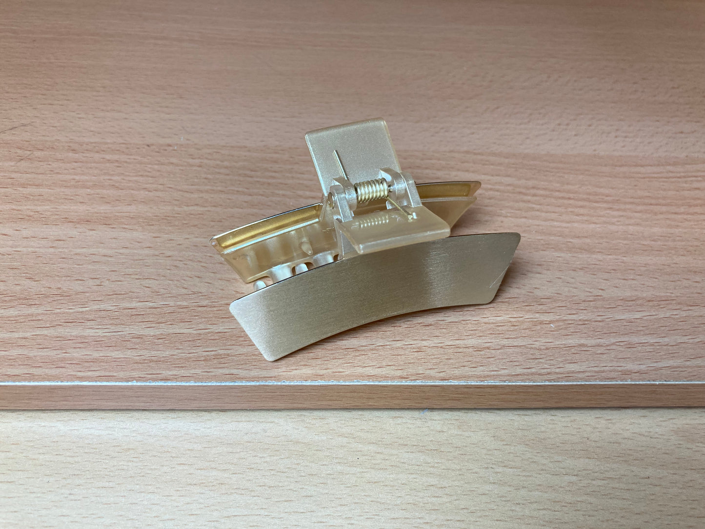 Tiny Treasures Seoul - Brushed Gold Mini Curved Bar Hair Claw Close up View
