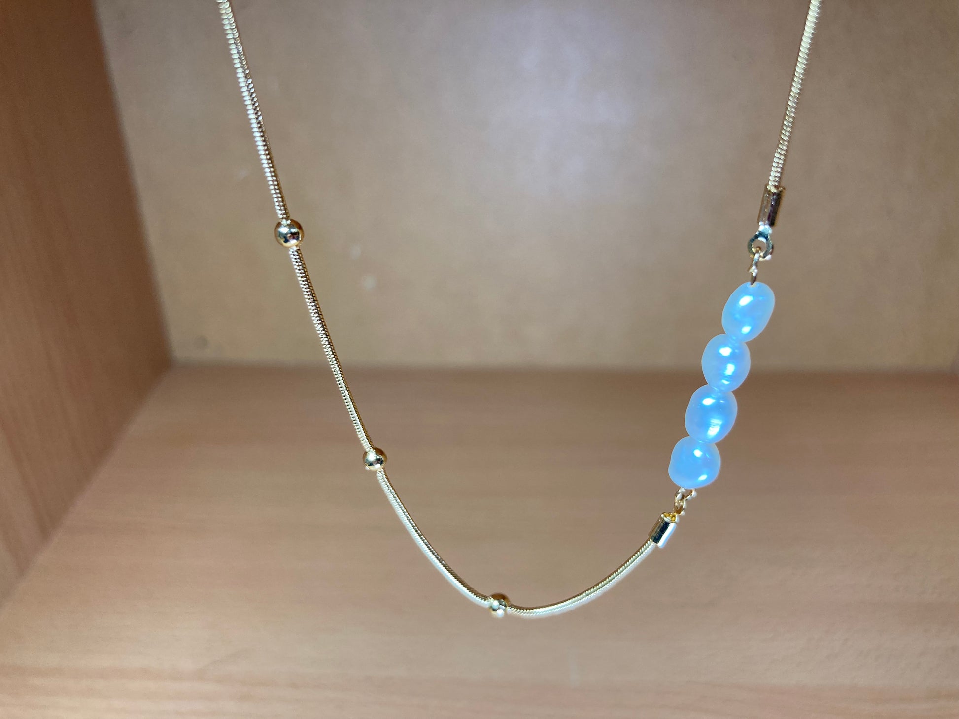 Tiny Treasures Seoul - Asymmetric Faux Pearl Gold Chain Necklace Close up View 5