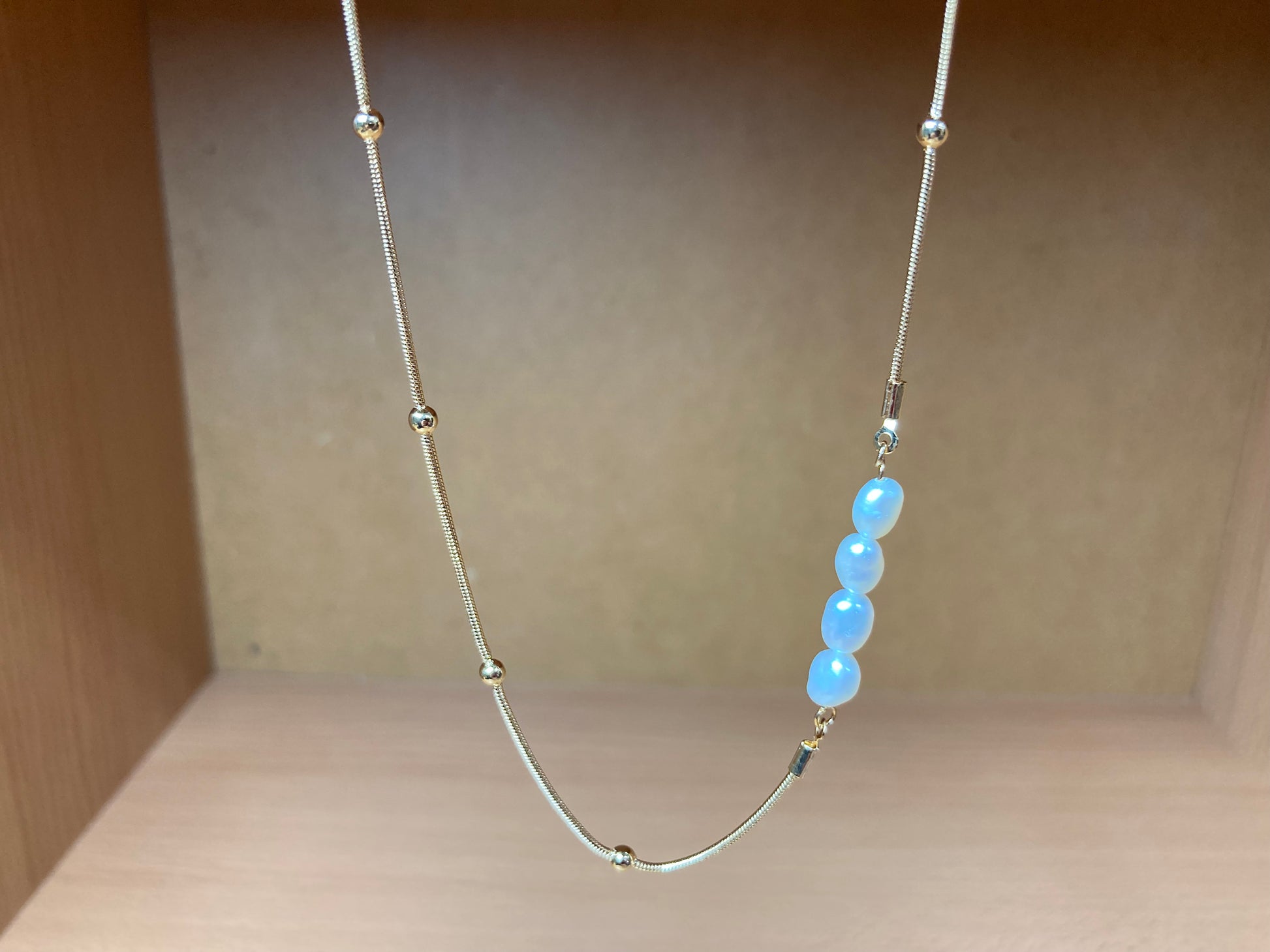 Tiny Treasures Seoul - Asymmetric Faux Pearl Gold Chain Necklace Front View