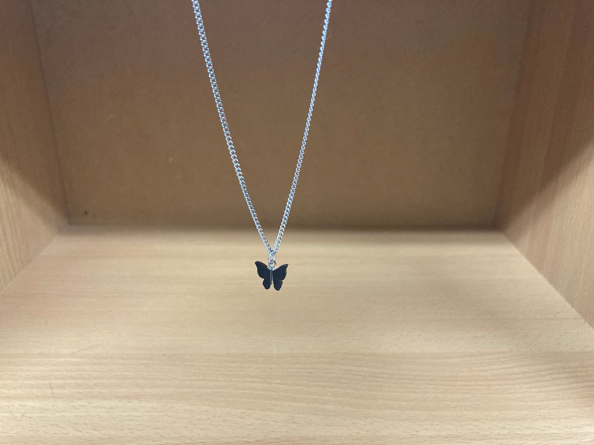 Tiny Treasures Seoul - Black Butterfly Surgical Steel Necklace Front View