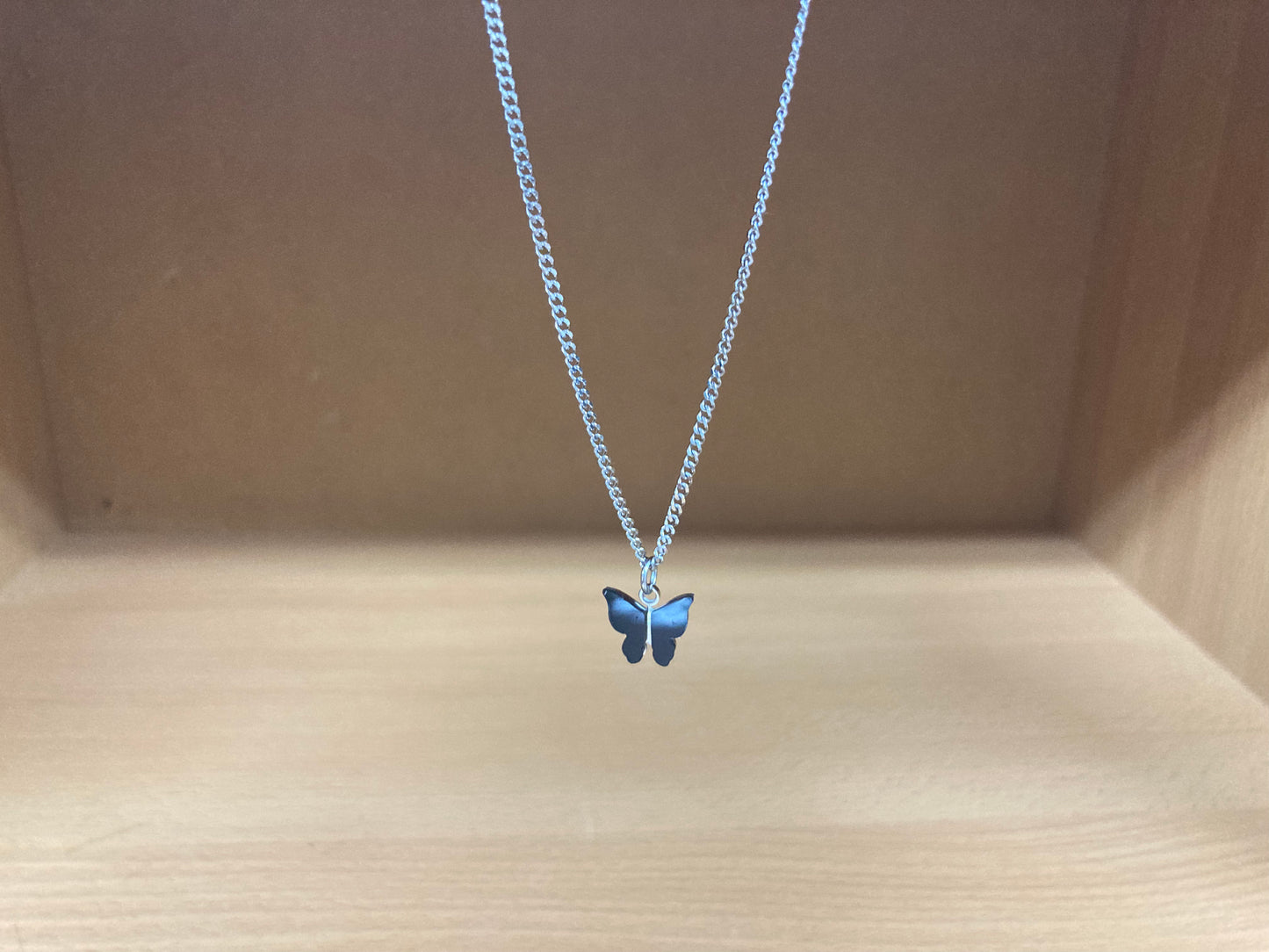 Tiny Treasures Seoul - Black Butterfly Surgical Steel Necklace Front View 2