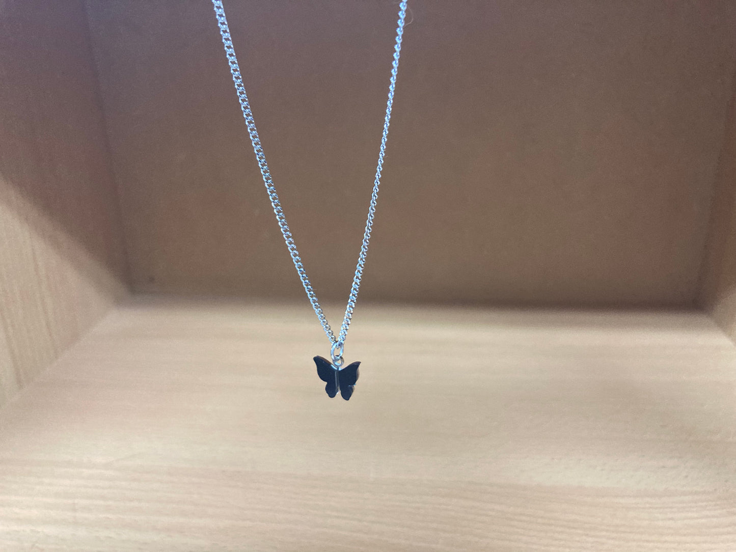 Tiny Treasures Seoul - Black Butterfly Surgical Steel Necklace Front View 3