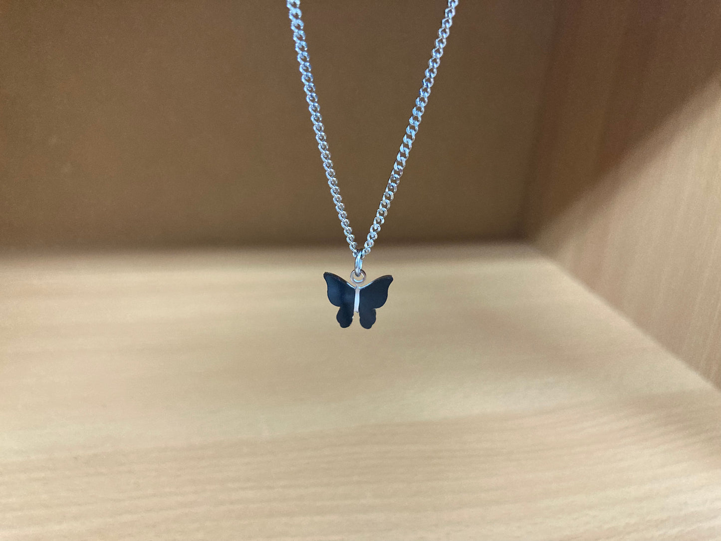 Tiny Treasures Seoul - Black Butterfly Surgical Steel Necklace Close up View