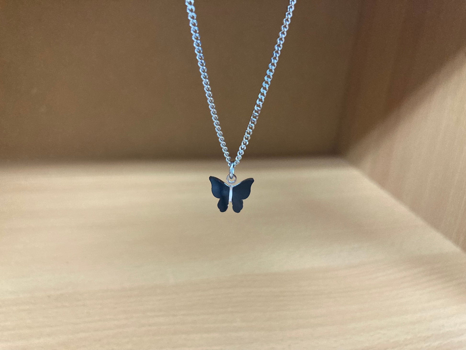 Tiny Treasures Seoul - Black Butterfly Surgical Steel Necklace Close up View