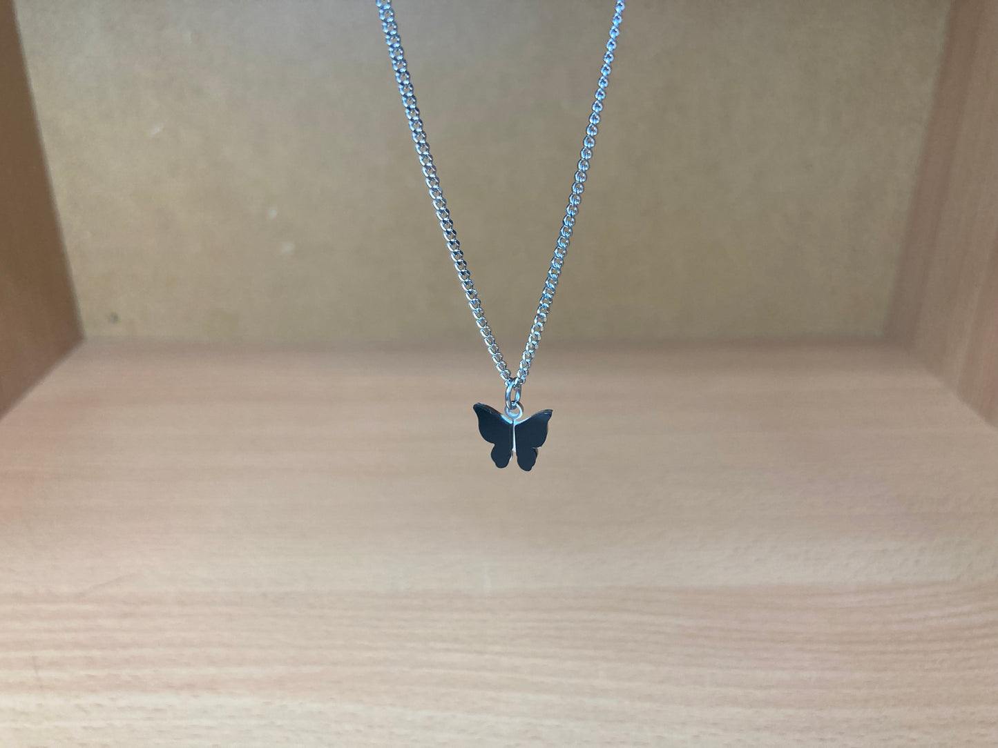 Tiny Treasures Seoul - Black Butterfly Surgical Steel Necklace Front View 5