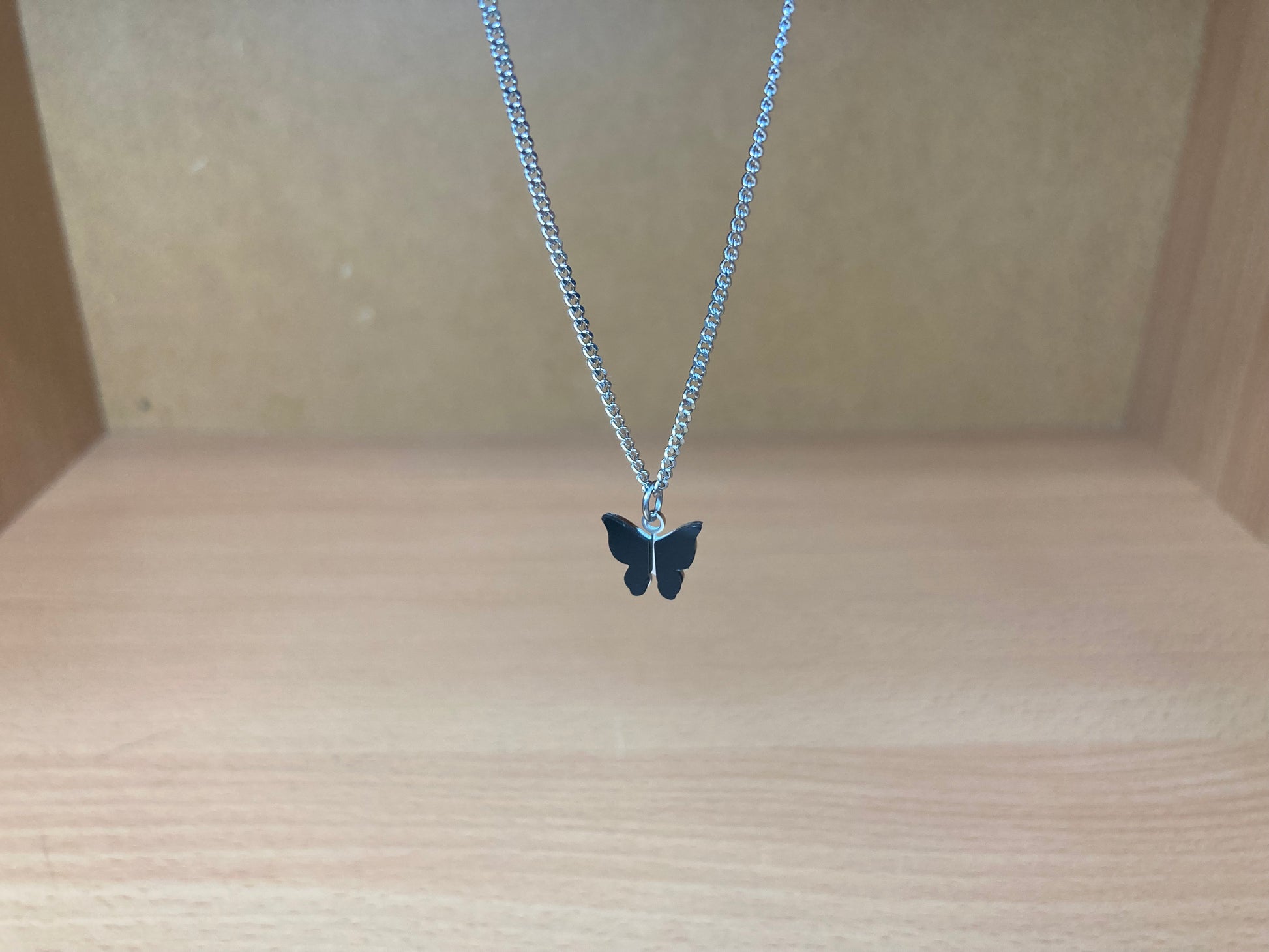 Tiny Treasures Seoul - Black Butterfly Surgical Steel Necklace Front View 5