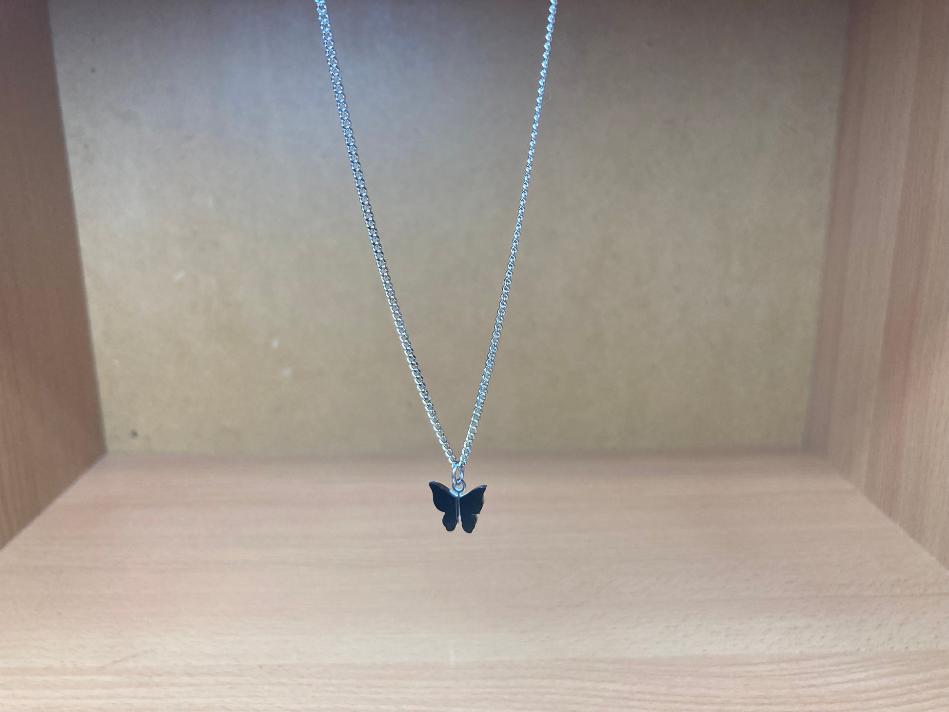 Tiny Treasures Seoul - Black Butterfly Surgical Steel Necklace Front View 6
