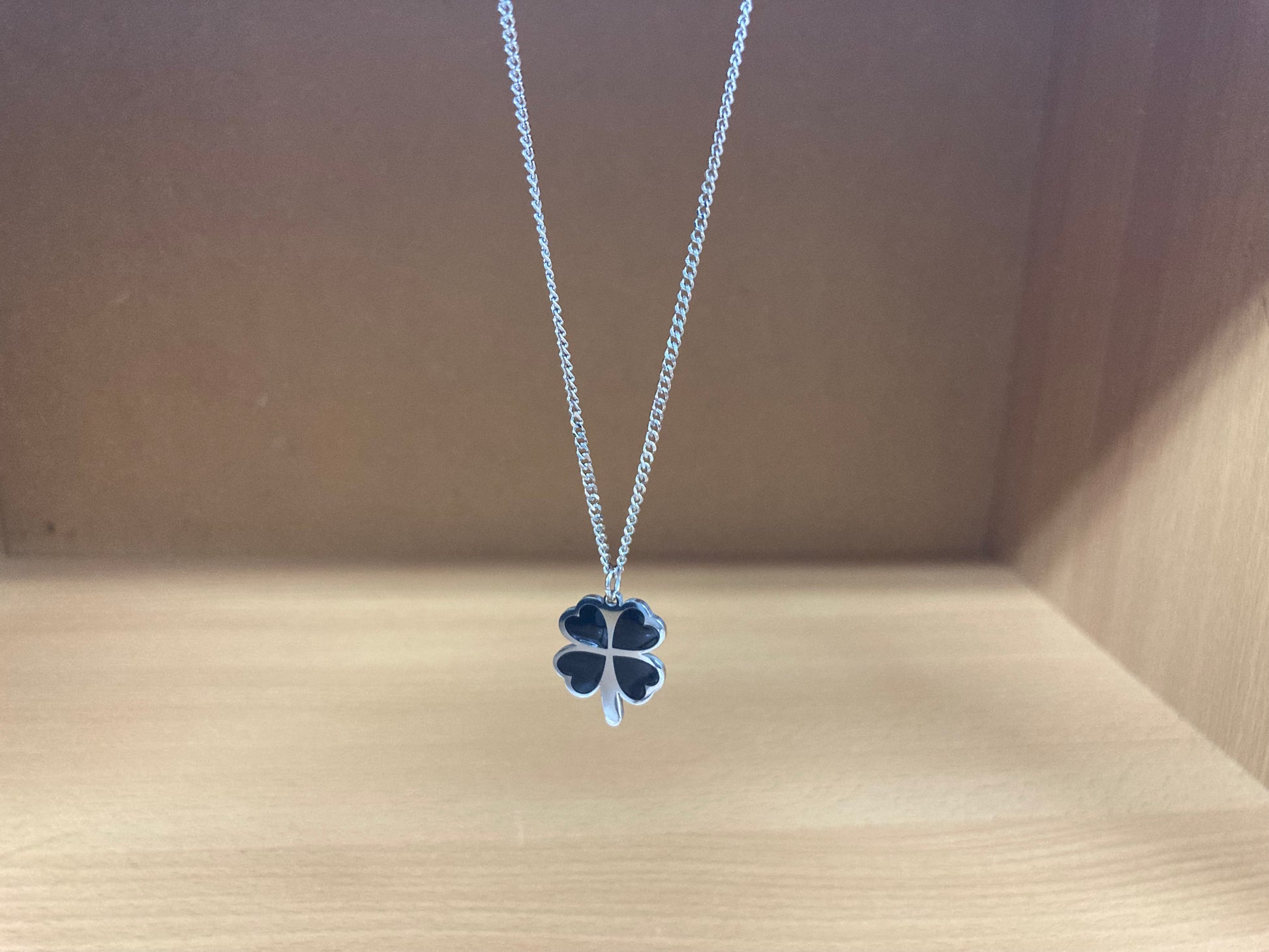 Tiny Treasures Seoul - Black Four-Leaf Clover Surgical Steel Necklace Front View