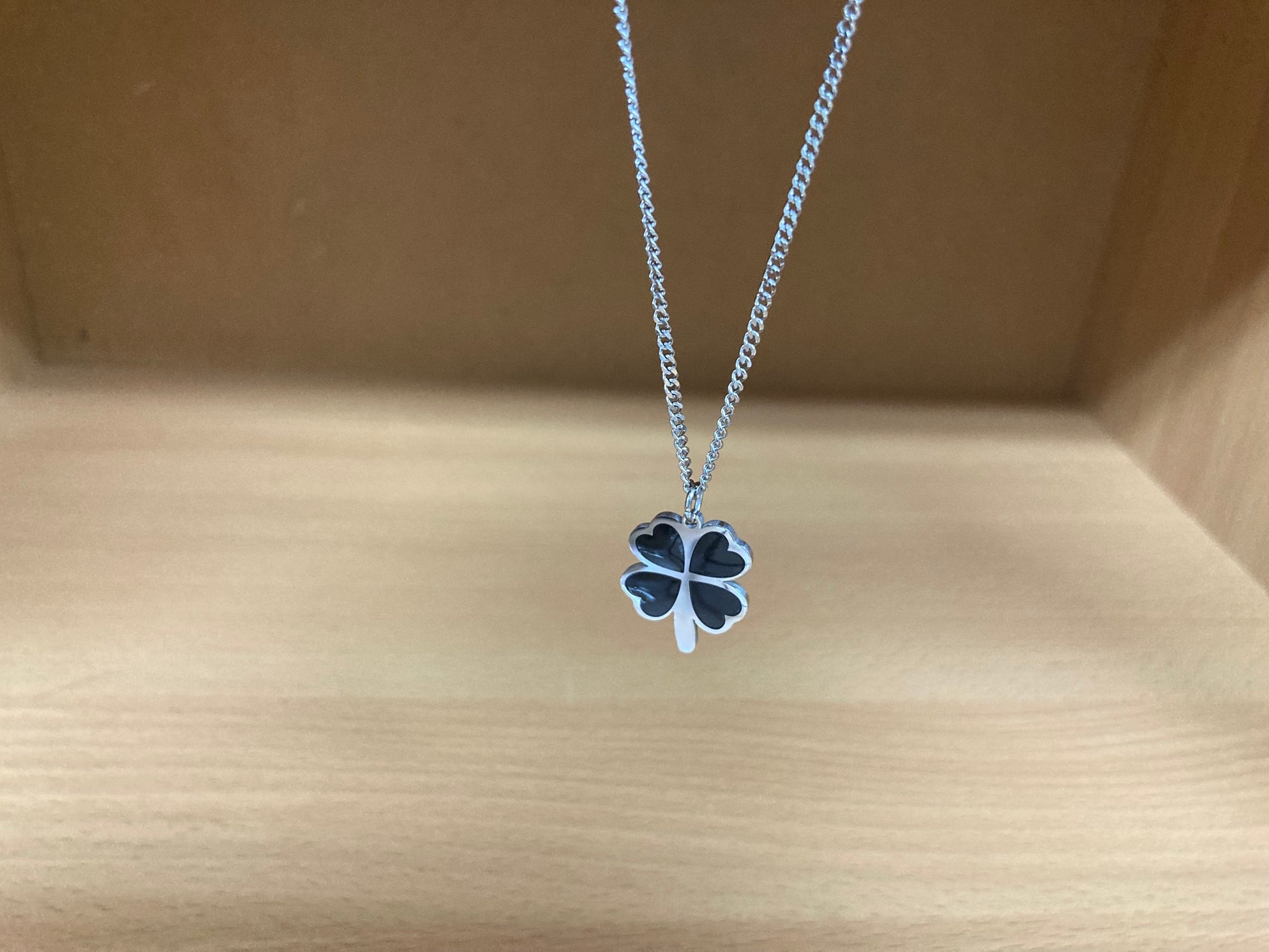 Tiny Treasures Seoul - Black Four-Leaf Clover Surgical Steel Necklace Close up View