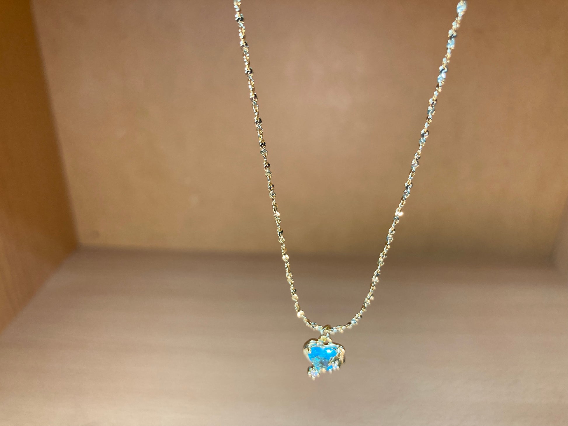Tiny Treasures Seoul - Blue Cubic Zirconia Heart Necklace (Gold) Close up View
