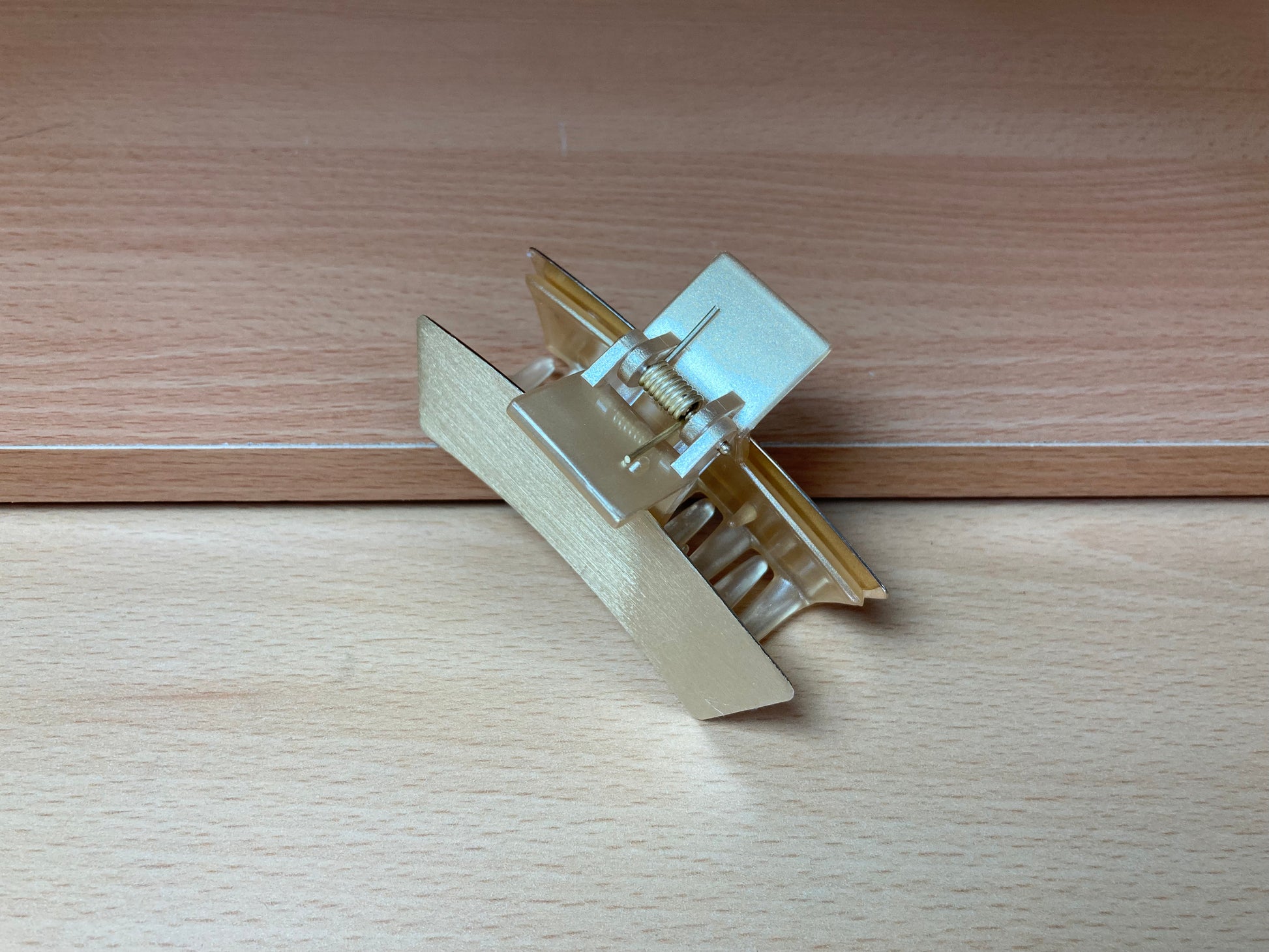 Tiny Treasures Seoul - Brushed Gold Mini Curved Bar Hair Claw Side View
