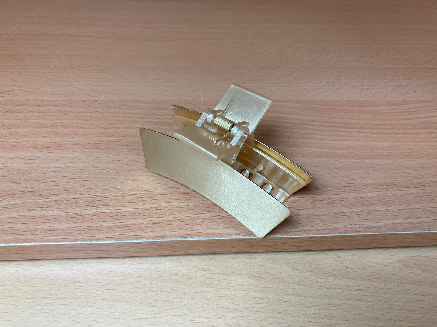 Tiny Treasures Seoul - Brushed Gold Mini Curved Bar Hair Claw Down View