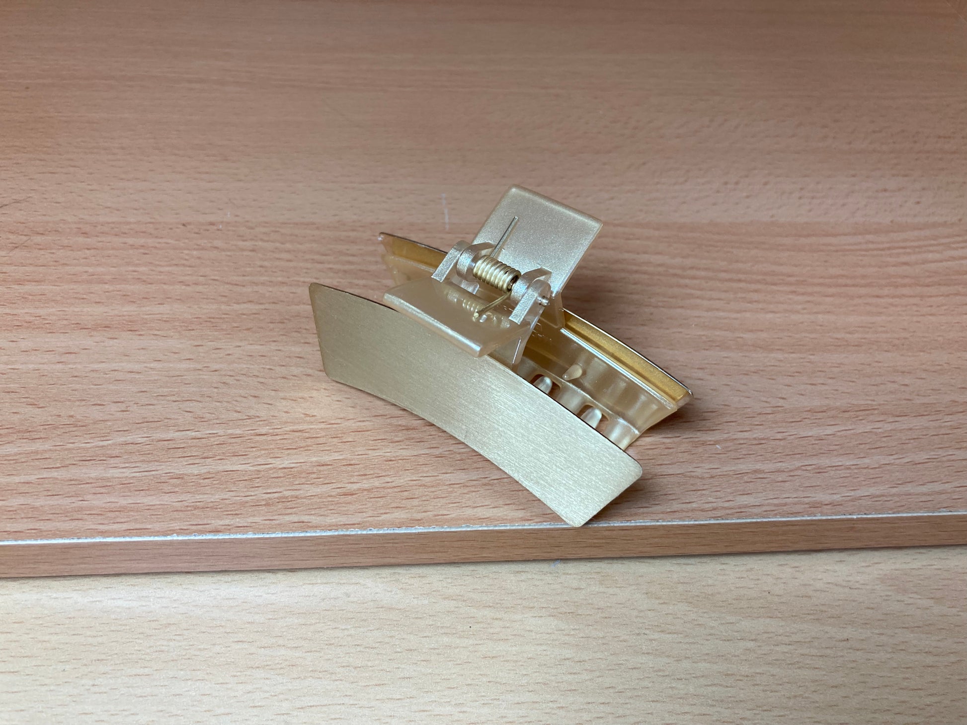 Tiny Treasures Seoul - Brushed Gold Mini Curved Bar Hair Claw Down View