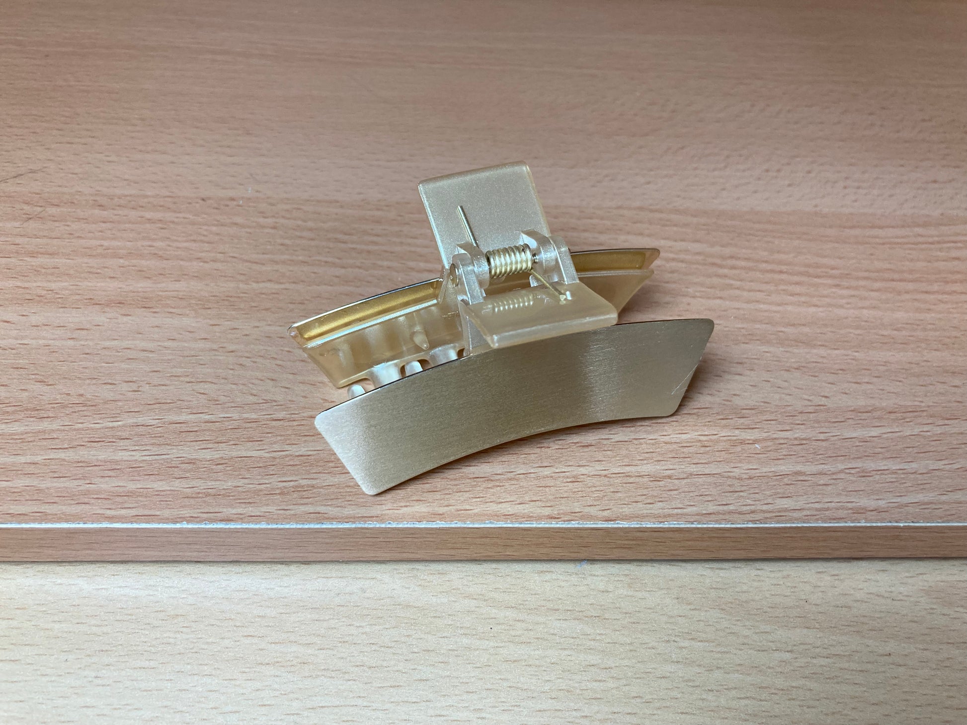 Tiny Treasures Seoul - Brushed Gold Mini Curved Bar Hair Claw Close up View