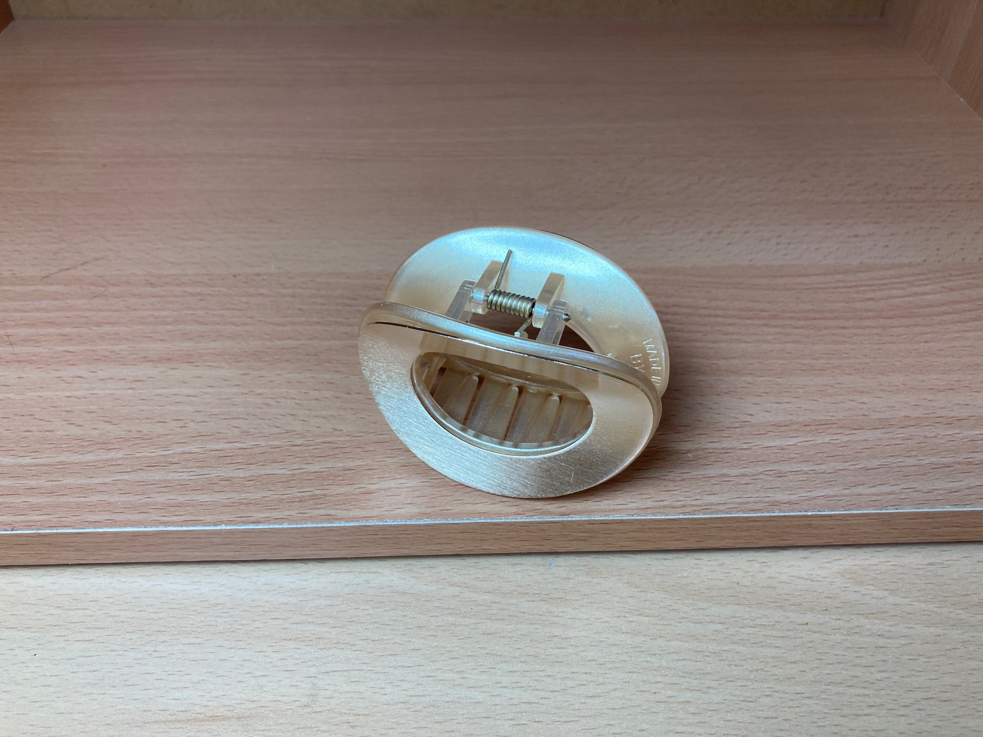 Tiny Treasures Seoul - Brushed Gold Open Oval Mini Hair Claw Front View 2