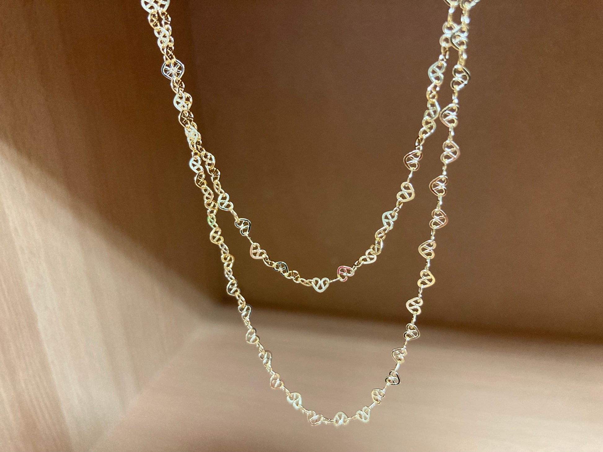 Tiny Treasures Seoul - Layered Heart Link Gold Necklace Close up View 6