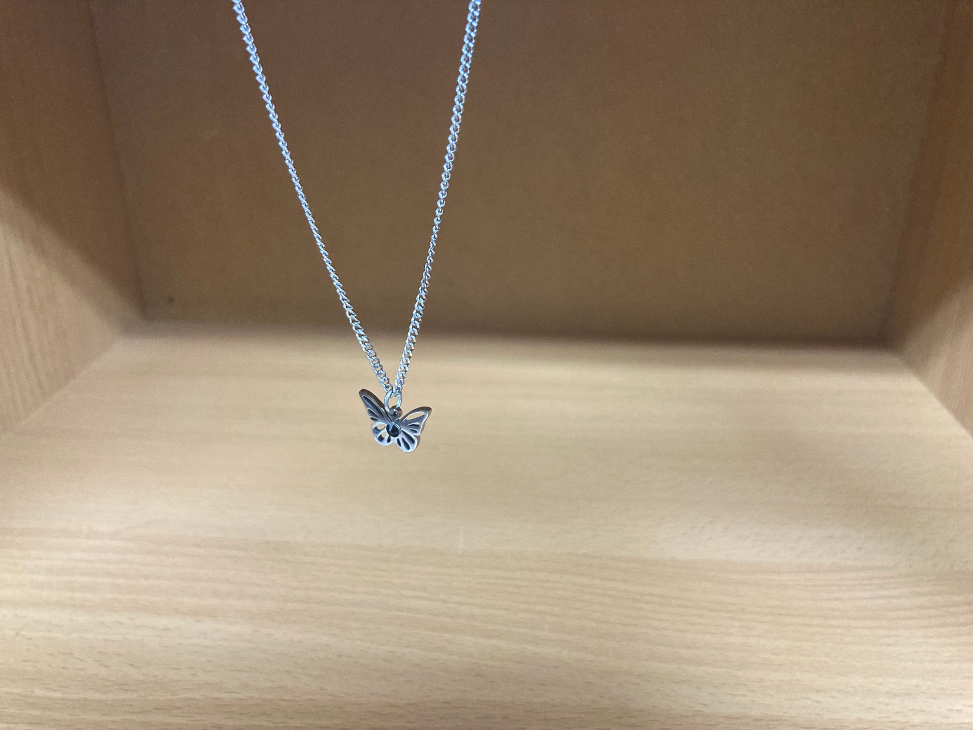 Tiny Treasures Seoul - Open Butterfly Surgical Steel Necklace Side View 2