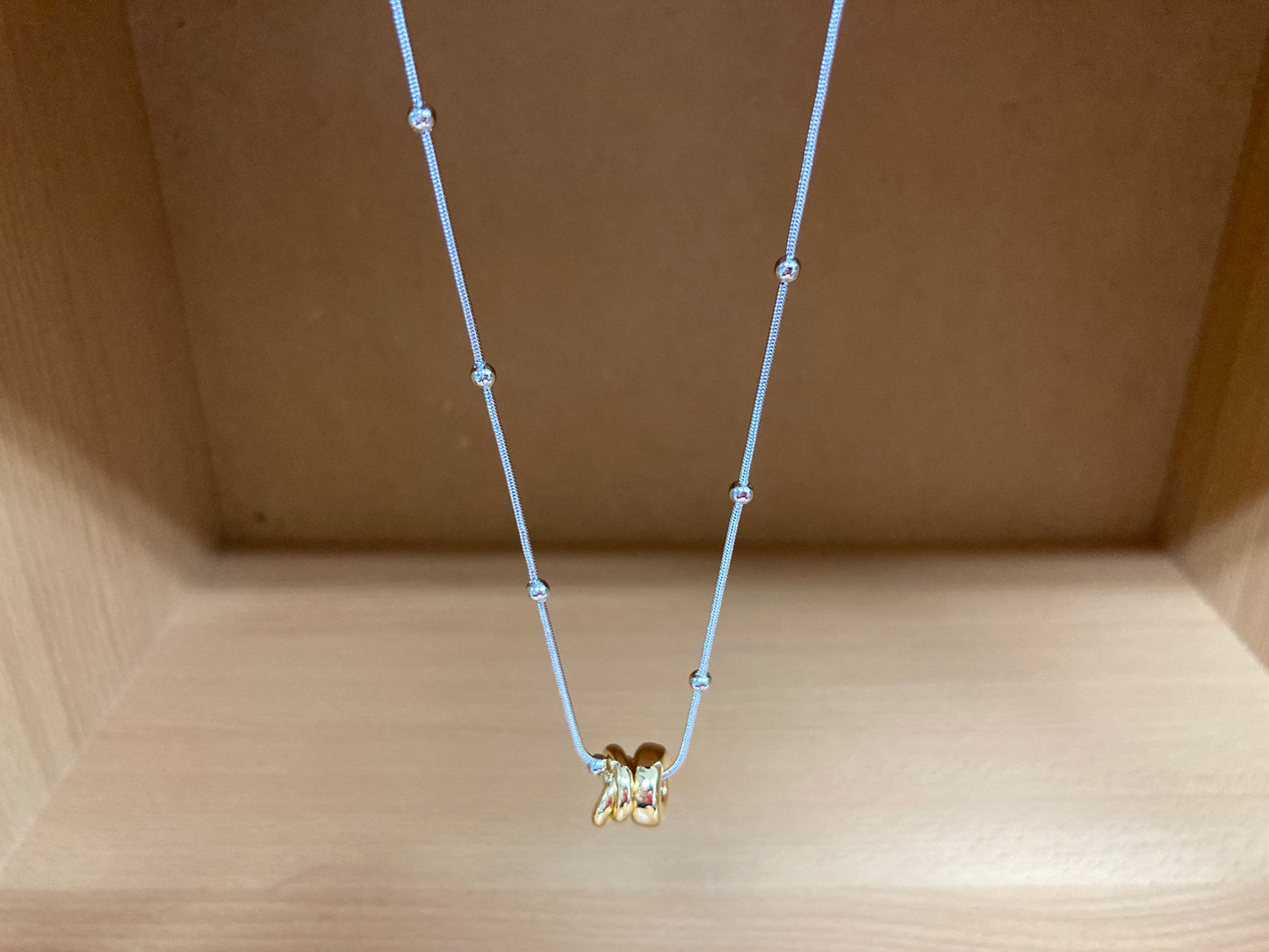 Tiny Treasures Seoul - Silver Chain Triple Gold Ring Necklace Close up View 5