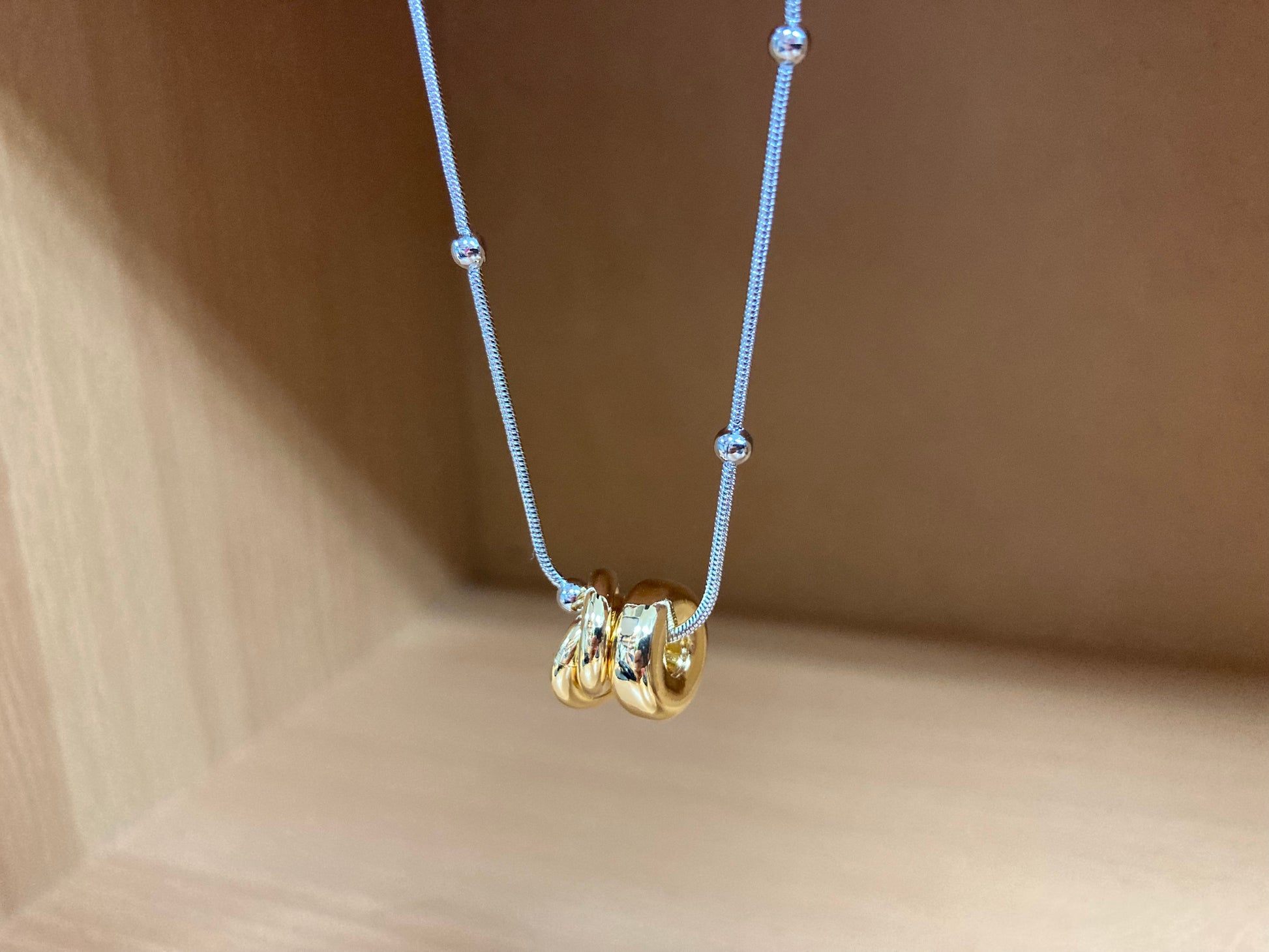 Tiny Treasures Seoul - Silver Chain Triple Gold Ring Necklace Close up View 6