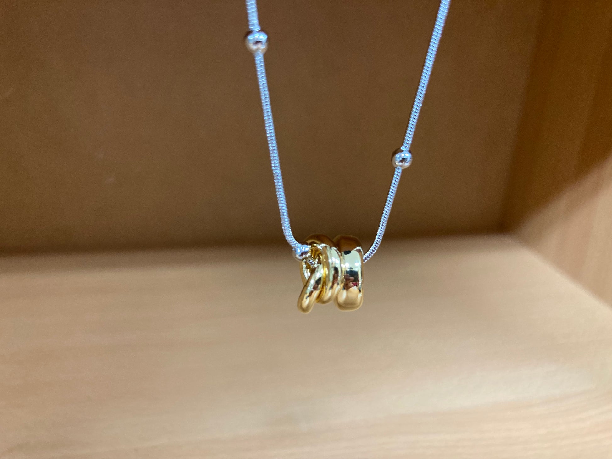 Tiny Treasures Seoul - Silver Chain Triple Gold Ring Necklace Close up View