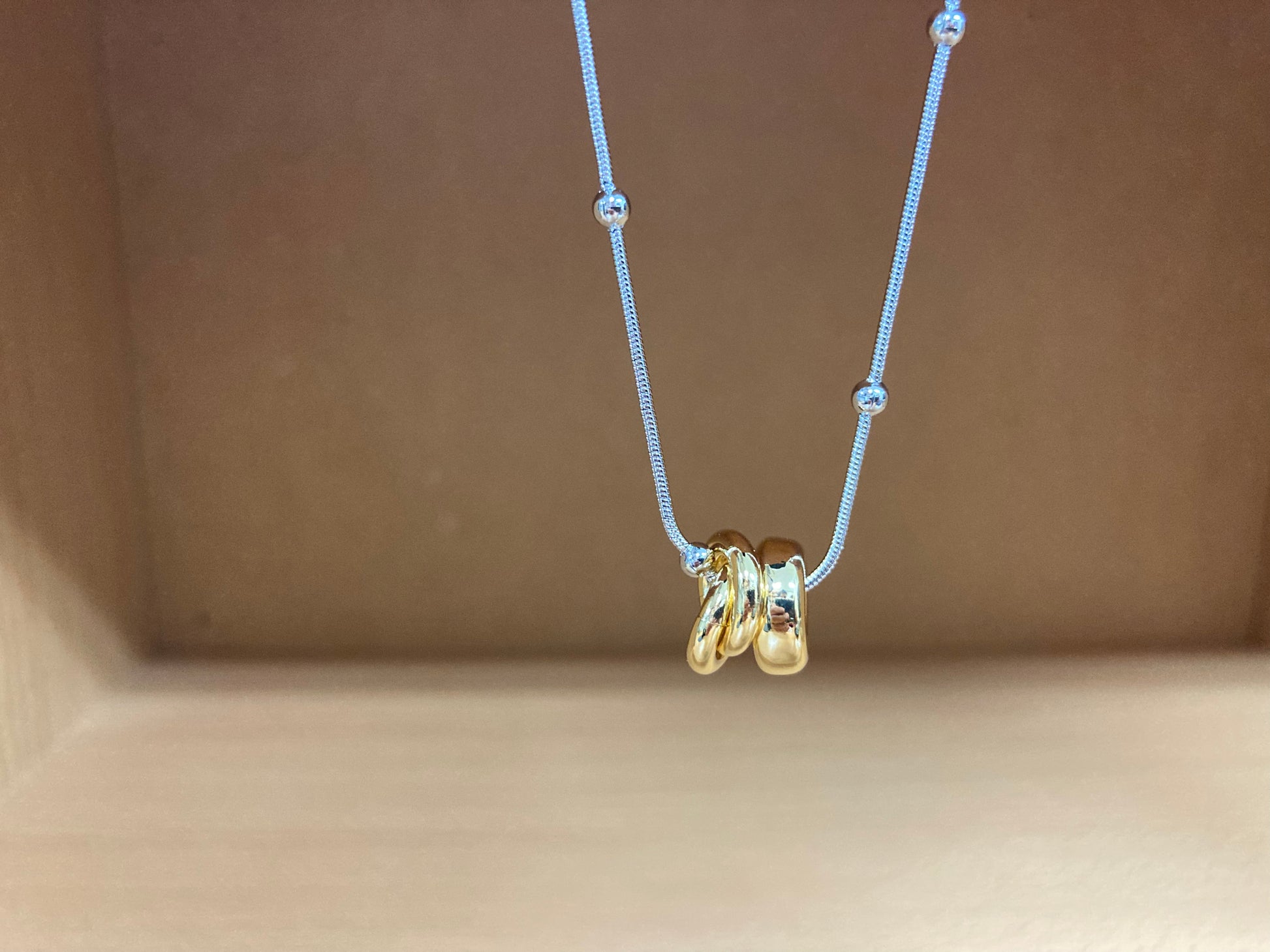 Tiny Treasures Seoul - Silver Chain Triple Gold Ring Necklace Close up View 7