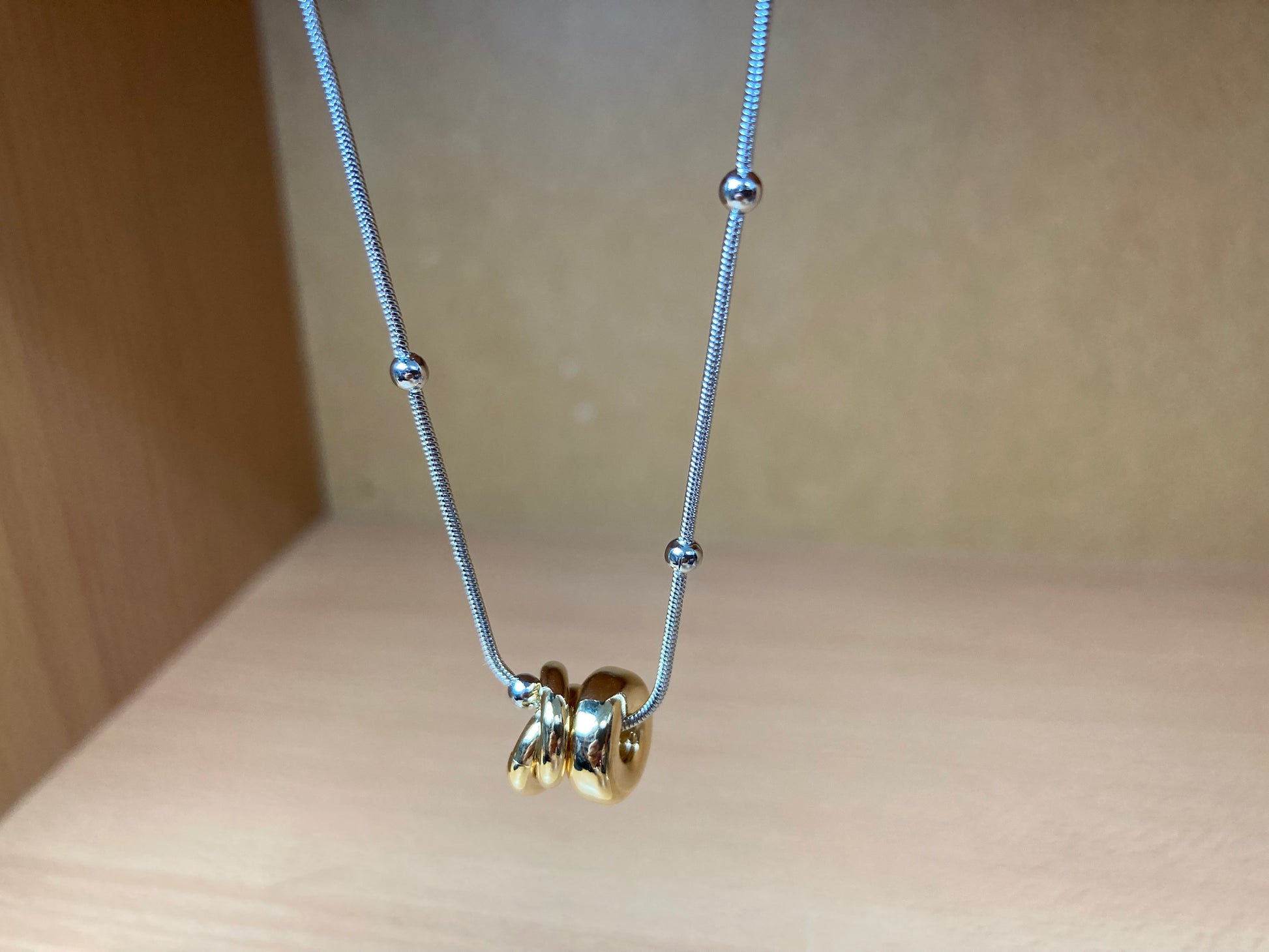 Tiny Treasures Seoul - Silver Chain Triple Gold Ring Necklace Close up View 2