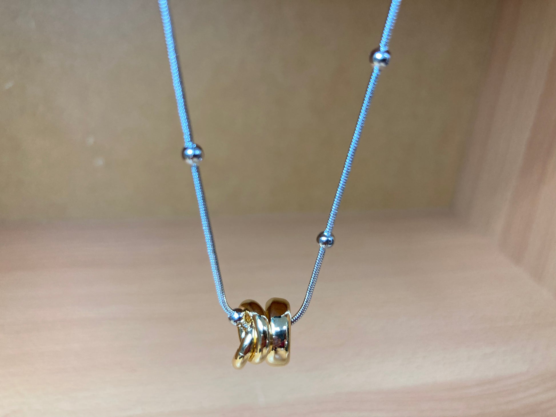 Tiny Treasures Seoul - Silver Chain Triple Gold Ring Necklace Close up View 3