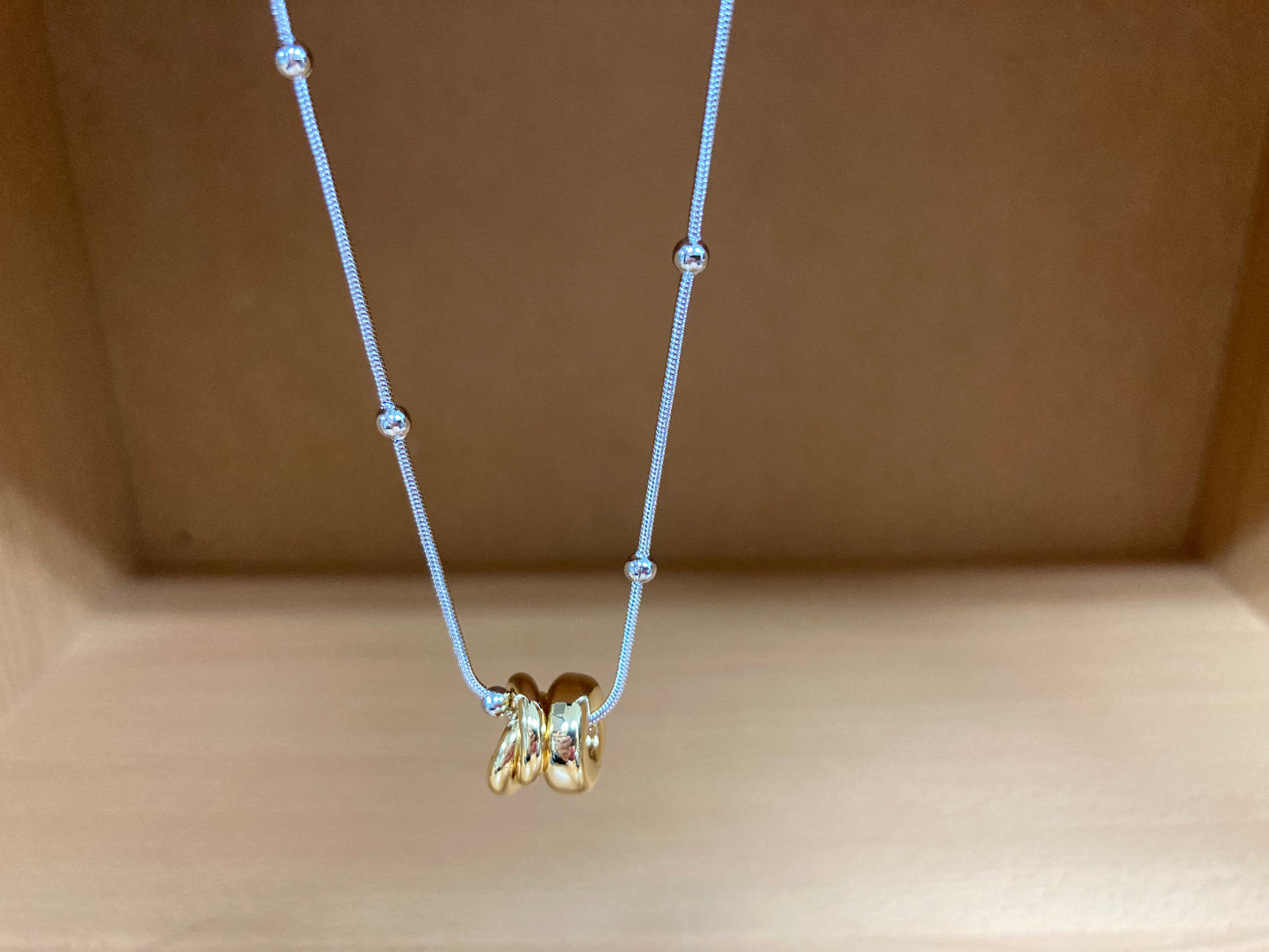Tiny Treasures Seoul - Silver Chain Triple Gold Ring Necklace Close up View 4